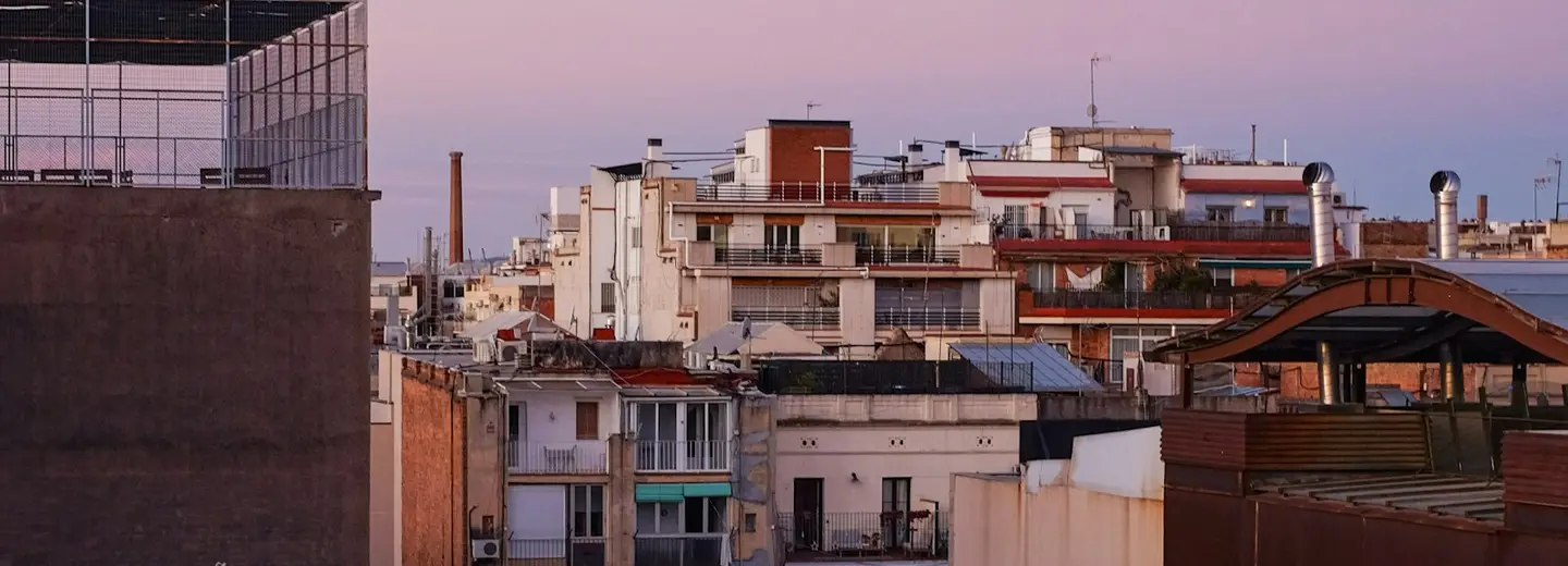 Barcelona's Eixample rooftops at dusk
